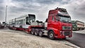 Red truck transporting tramway. Operated by Panas company.