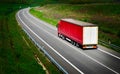 Red truck trucking on highway