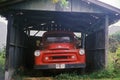 A red truck under an old carport in Hawaii