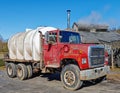 truck with white maple sugar container waiting for maple sugar syrup early Spring