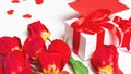 Red tulips, gift box and greeting card with hearts for Valentine`s Day Royalty Free Stock Photo