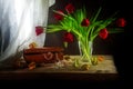 Red tulips, jewelery box, some physalis and white curtain, still Royalty Free Stock Photo