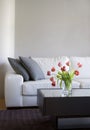 Red tulips in modern living room - home decor Royalty Free Stock Photo