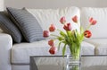 Red tulips in modern living room - home decor Royalty Free Stock Photo