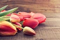 Red tulips on rustic wooden background. Spring flowers. Spring b Royalty Free Stock Photo