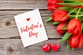Red tulips and Valentine`s day greeting card Royalty Free Stock Photo