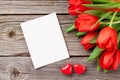 Red tulips and Valentine`s day greeting card Royalty Free Stock Photo