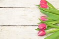 red Tulips on white rustic wooden background. Spring flowers. Spring background. Greeting card for Easter Royalty Free Stock Photo