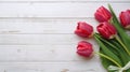 red tulips on a wooden table, capturing the beauty and freshness of nature indoors. Easter, Women\'s Day, Mother\'s day.