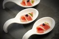 Red tuna on porcelain spoons Royalty Free Stock Photo