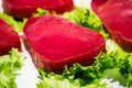 Red tuna steak with lettuce Royalty Free Stock Photo