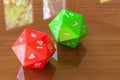 Red twenty-sided die, 20 sides on the wooden table. 3D rendering Royalty Free Stock Photo