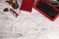 Red typewriter on the table with the office. Royalty Free Stock Photo