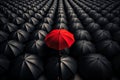 Red umbrella in a crowd of black one Royalty Free Stock Photo