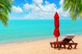 Red umbrella, deck chair, parasol, sun lounger, chaise lounge, sun bed, palm, tropical island sea beach, summer holidays, vacation Royalty Free Stock Photo