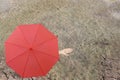 Red umbrella and a hand of man standing on soil dry pond and han Royalty Free Stock Photo