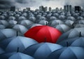 Red umbrella outstanding from the others Royalty Free Stock Photo