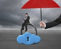 Red umbrella protect businessman using tablet on cloud lock Royalty Free Stock Photo