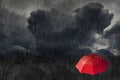 Red umbrella stand out from group of many black umbrellas. Royalty Free Stock Photo