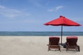 Red umbrella and two chairs Royalty Free Stock Photo