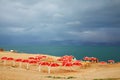 Red umbrellas and green sea Royalty Free Stock Photo
