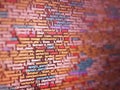 Red unique background. Programming PHP on laptop computer screen. Program code PHP HTML CSS of site. Royalty Free Stock Photo