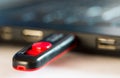 Red usb pendrive on laptop computer close up macro shot Royalty Free Stock Photo