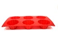 Red used silicone cupcake mold isolated on white background