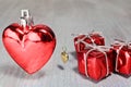 Red valentine or christmas heart with gift box and gold heart on Royalty Free Stock Photo