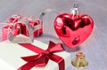Red valentine or christmas heart and gifts with small jingle and