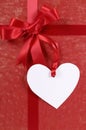 Red valentine gift, white heart shape gift tag or label, copy sp Royalty Free Stock Photo