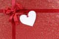 Red valentine gift, white heart shape gift tag or label, copy space Royalty Free Stock Photo