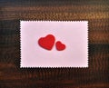 Red valentine hearts paper gift card on table Royalty Free Stock Photo