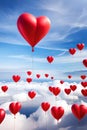 Red Valentine love balloons floating above cloudy sky