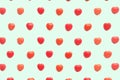 Red Valentine`s day heart candy pattern on green pastel paper color background. Love Concept. colorful hipster style. top view.