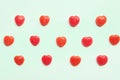 Red Valentine`s day heart candy pattern on green pastel paper color background. Love Concept. colorful hipster style. top view. Royalty Free Stock Photo