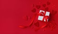 Red Valentines day background. Gift box and mixed hearts top view. Flat lay