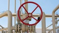 Red valve handwheel on a crane located on a gas pipeline