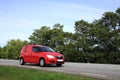 Red van on road Royalty Free Stock Photo