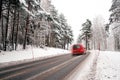 Red van on winter road Royalty Free Stock Photo