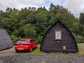 Red Vauxhall Opel Astra car. Travelling around Scotland in a brand new vehicle and sleeping in a cottage in a camp site