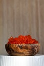 Red vegan caviar from kelp seaweed in a wooden bowl. Valuable and useful product for a healthy diet. Superfood. Close-up Royalty Free Stock Photo