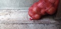 A Red Bag of Onions Against A Wall Royalty Free Stock Photo