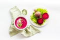 Red vegetarian beet root soup with sour cream and raw beets Royalty Free Stock Photo