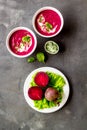 Red vegetarian beet root soup with sour cream and raw beets Royalty Free Stock Photo