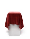 Red velor cloth on a square pedestal isolated on white Royalty Free Stock Photo