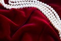 Red velvet background with pearls Royalty Free Stock Photo