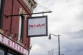 The Red Velvet Bistro in O`neal Plaza with bare winter trees, blue sky and clouds in Douglasville Georgia