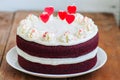 Red velvet cake with cream cheese frosting and heart shaped red Royalty Free Stock Photo