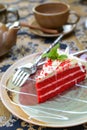 Red velvet cake with cup of tea and kettle Royalty Free Stock Photo